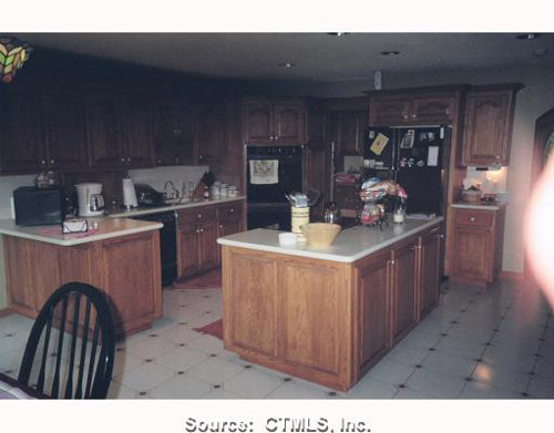 Looove the glowing thumb in the corner!  Well...at least something was well lit in the photo...too bad it wasn't the kitchen!  This home is listed for $650,640 in Connecticut