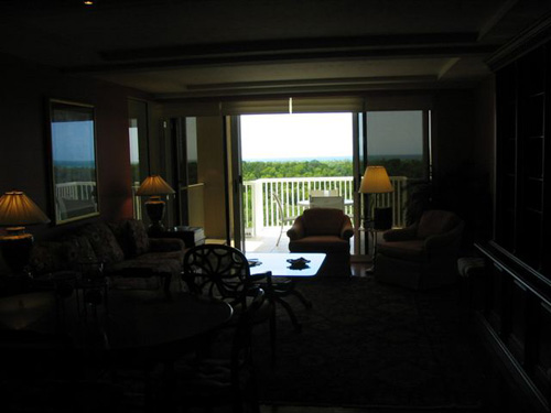 This agent-shot photo is very dark-- you're unable to really see the room at all, just the balcony opening and a shadow of the chair in front of it.  As you can see, they seemed to be shooting directly at the window.