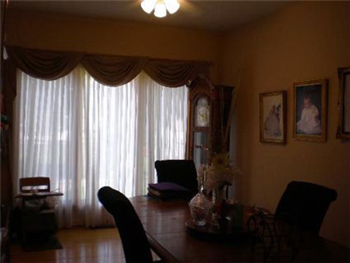 Showcasing this dining room with a darker photo probably isn't going to help potential buyers envision future years of warm and happy family dinners.  This Illinois home is listed for $499,900.