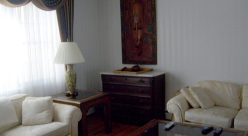 By shooting just the corner of this room, focusing more on the furniture than the space, it ends up looking much smaller than it probably is.  This is a $489,000 listing in New York.