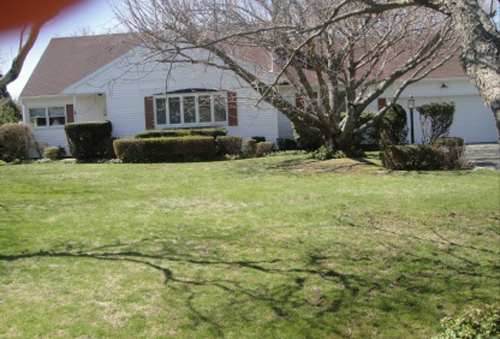 Oh my... a crooked photo complete with a thumb in the upper left corner... probably not the best way to market this $999,000 Long Island listing!