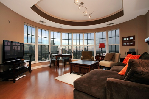 The view of Atlanta is wonderfully displayed in this lovely living room.  This home is listed for $325,000 by Carrie Faletti of Harry Norman.  Click the photograph to view more of this listing.