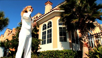 Luxury Real Estate on Footage Attractive Female Real Estate Agent Offering Luxury Properties